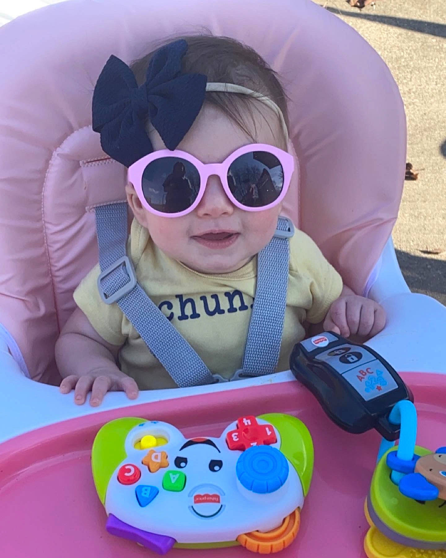 Maria is registered to the contest to win money with this photo: baby, baby_playing_with_toys, baby_products, baby_toddler_clothing, child, comfort, eyewear, fun, glasses, goggles, happy, head, person, pink, product, purple, sleeve, sunglasses, toddler, toy