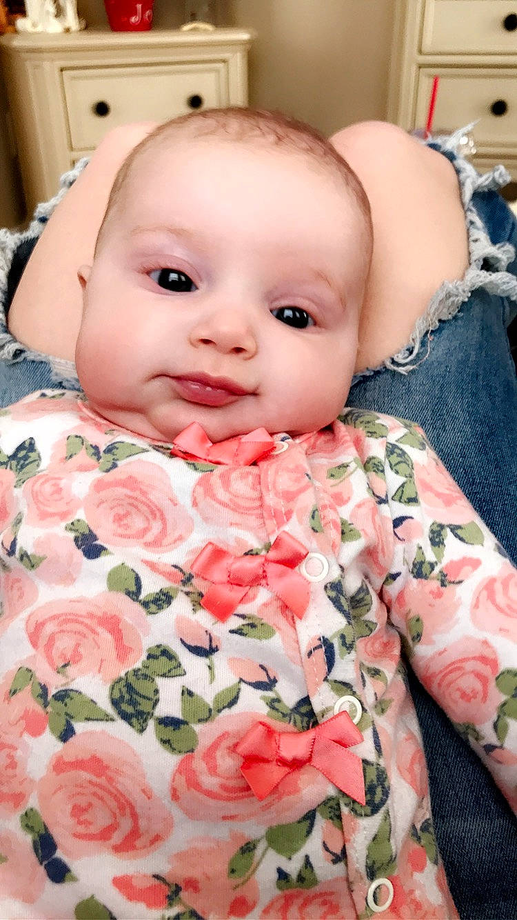 Evie joined the competition — help win amazing prizes! baby, baby_products, beauty, cheek, child, eye, face, flower, head, iris, lip, mouth, nose, person, pink, plant, rose, skin, smile, textile