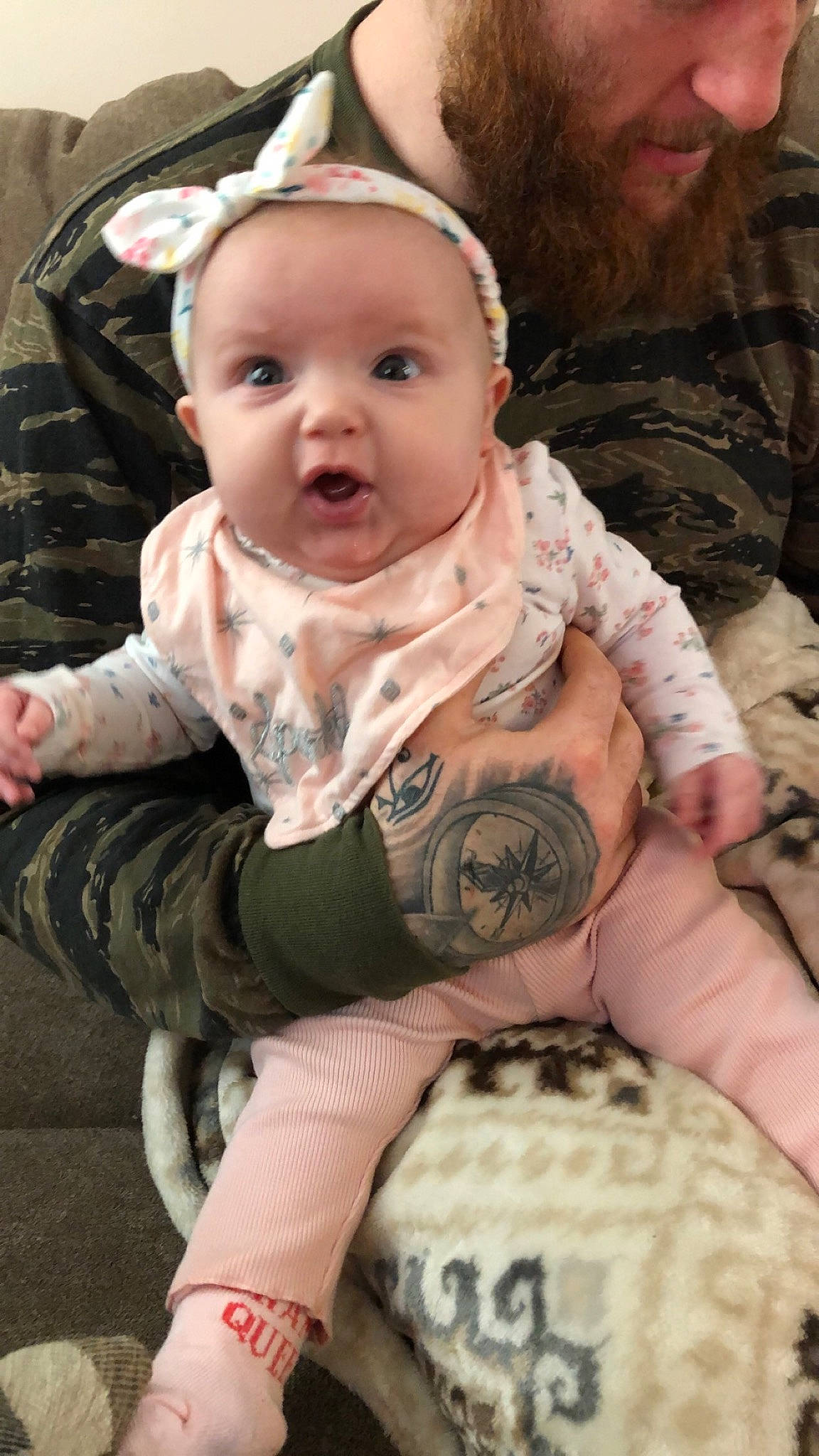 Evie is registered to the contest to win money with this photo: arm, baby, cheek, child, person, sitting, skin, surprise, toddler