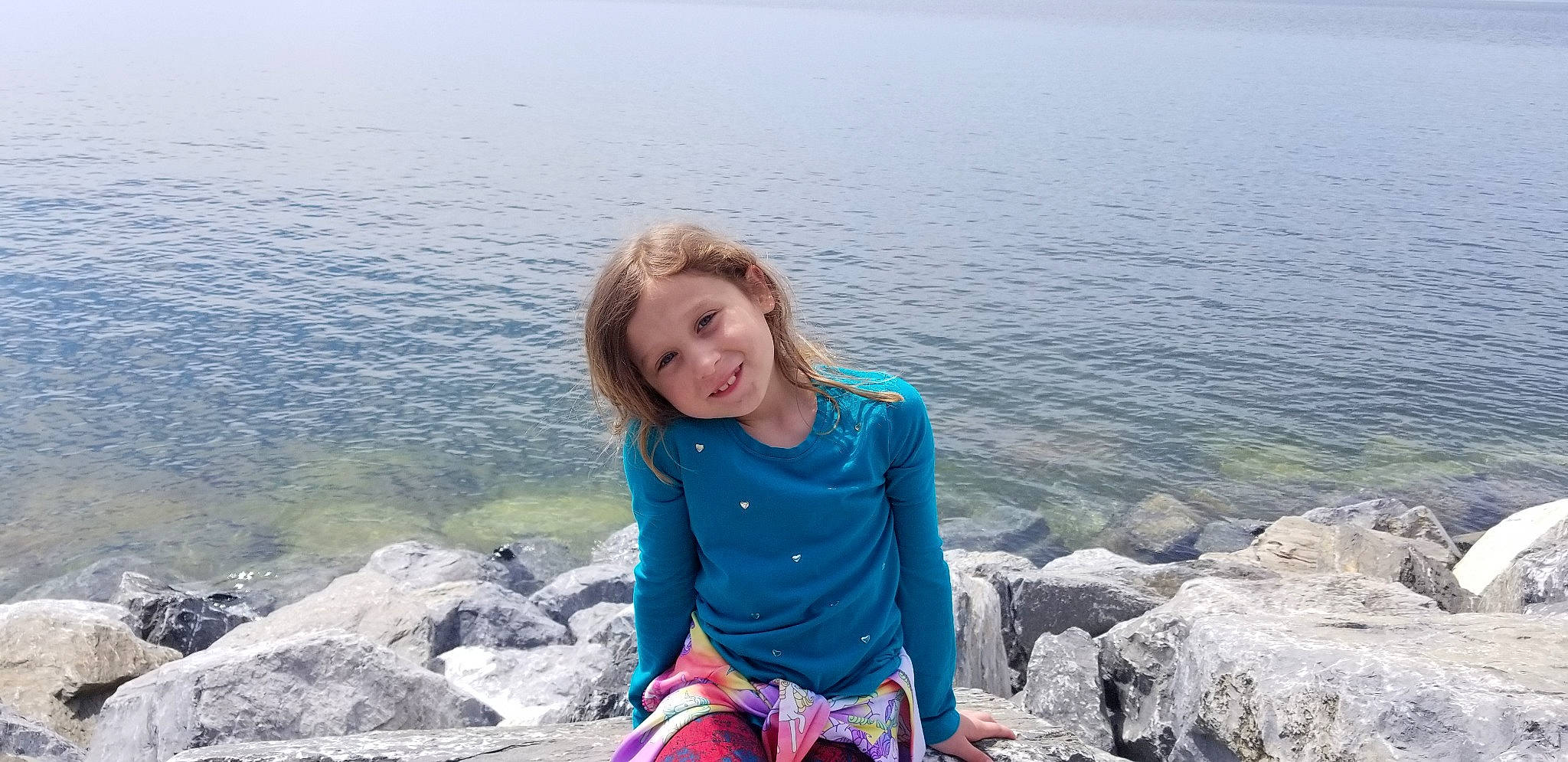 Alida joined the competition — help win amazing prizes! beach, child, coast, fun, happy, joy, leg, leisure, ocean, person, photography, rock, sea, sitting, smile, summer, tourism, travel, vacation, water