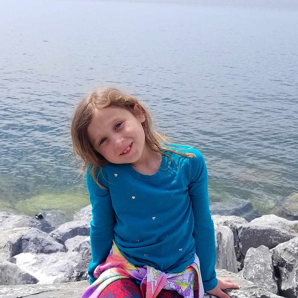Alida joined the competition — help win amazing prizes! beach, child, coast, fun, happy, joy, leg, leisure, ocean, person, photography, rock, sea, sitting, smile, summer, tourism, travel, vacation, water
