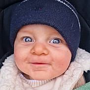 Kameron participe au concours pour gagner de l'argent avec cette photo : baby, child, face, blue_eyes, hat, knit_hat, jacket, coat, blanket, closeup, cute, infant, warm_clothing, portrait, outdoor, smile, person, young_child, apparel, headwear