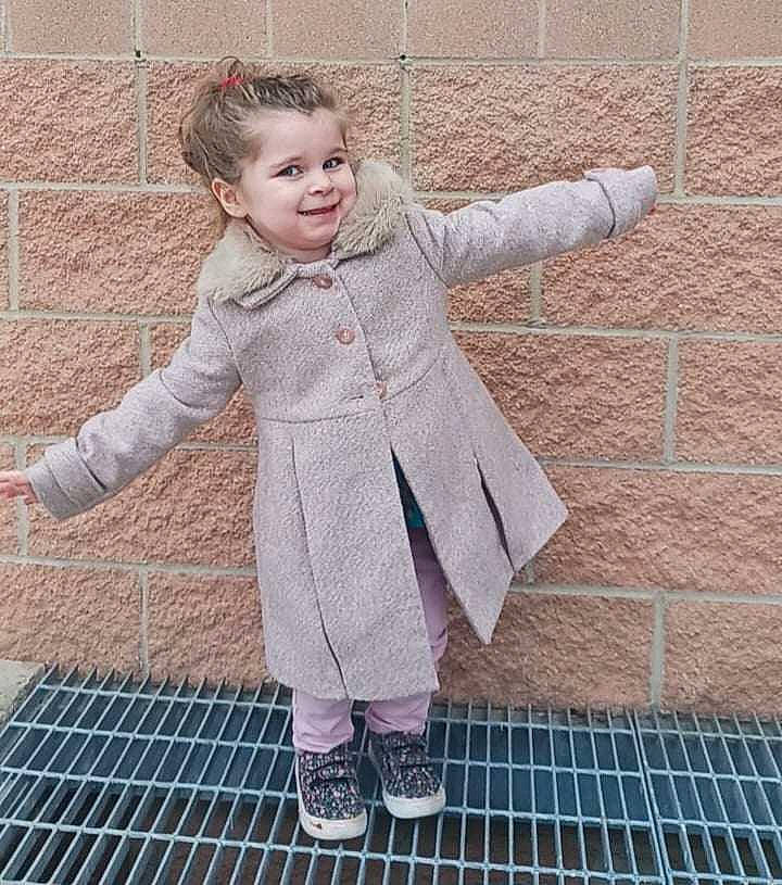 Adalyn is registered to the contest to win money with this photo: brick, brickwork, denim, fur, happy, human_leg, joint, joy, leg, mesh, outerwear, pattern, people_in_nature, person, photograph, pink, shoe, sleeve, smile, snapshot
