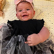 Hope joined the competition — help win amazing prizes! baby, smiling, headband, bow, dress, black_dress, lace, blanket, crocheted_blanket, hand, face, happy, infant, person, portrait, cute, indoor, soft_lighting, child, apparel