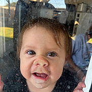 Aspen joined the competition — help win amazing prizes! toddler, child, face, window, glass, smudges, curious, expression, indoors, hand, nose, mouth, eyes, reflection, light, skin, hair, shirt, closeup, portrait