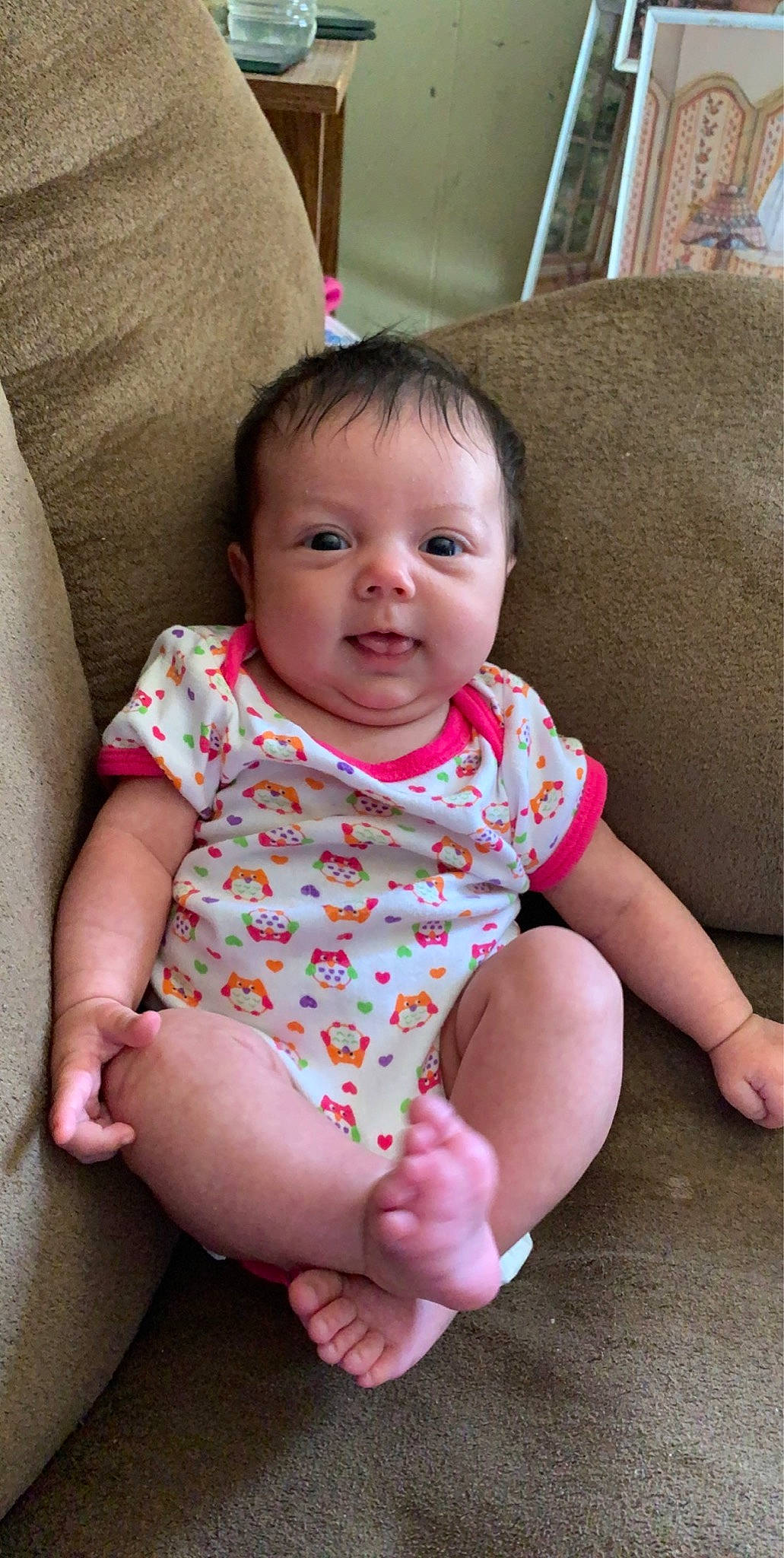 Rozlynn is registered to the contest to win money with this photo: baby, baby_toddler_clothing, cheek, child, face, finger, head, leg, lip, person, pink, play, sitting, skin, smile, toddler