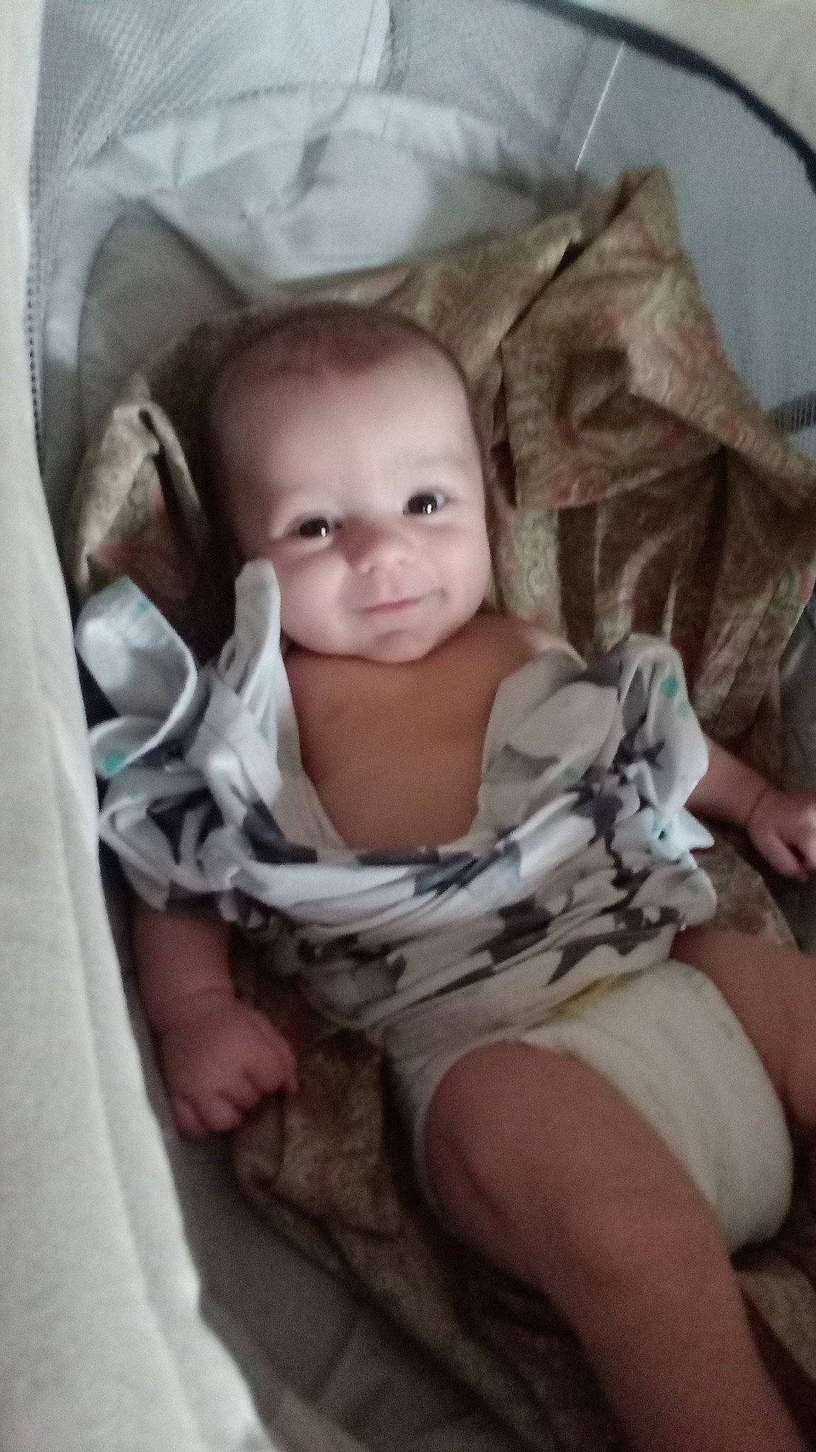 Sebastian is registered to the contest to win money with this photo: baby, baby_toddler_clothing, cheek, child, comfort, eye, finger, human_leg, iris, linens, mouth, person, sitting, skin, sleeve, smile, textile, thigh, thumb, toddler