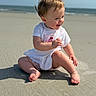 baby, child, beach, sand, ocean, smiling, happy, sunlight, outdoor, toddler, cute, playful, summer, casual_clothing, barefoot, portrait, sitting, nature, vacation, joy