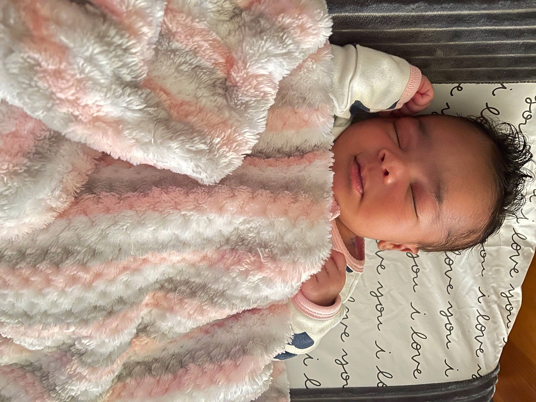 Karlie is registered to the contest to win money with this photo: arm, baby, baby_sleeping, baby_toddler_clothing, cheek, comfort, finger, gesture, hand, headgear, human_body, linens, lip, nose, person, pink, skin, sleeve, textile, toddler