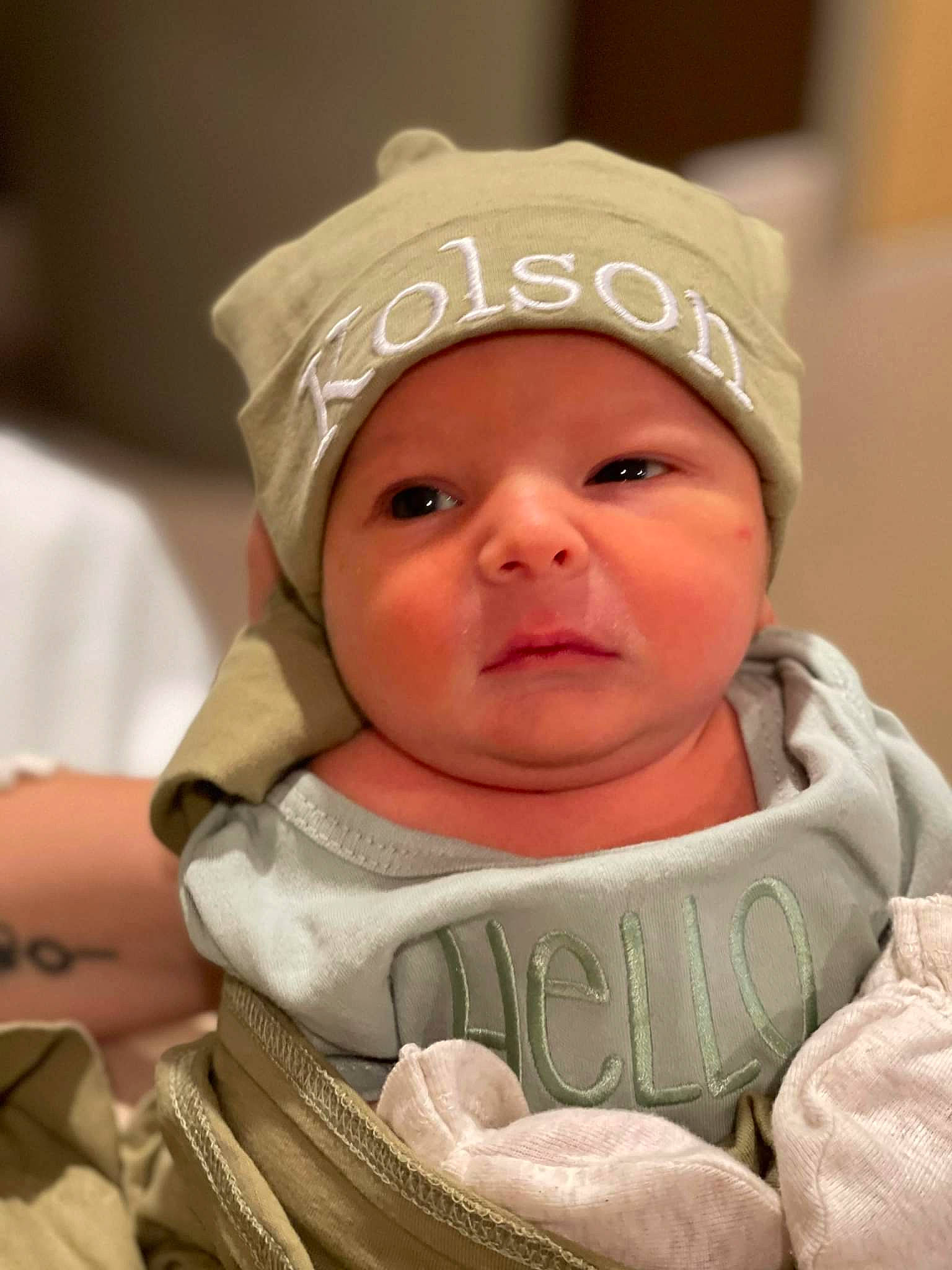 Kolson is registered to the contest to win money with this photo: baby, baby_toddler_clothing, cap, cheek, child, comfort, eye, eyebrow, face, facial_expression, fun, happy, headgear, headwear, iris, lip, mouth, person, room, skin