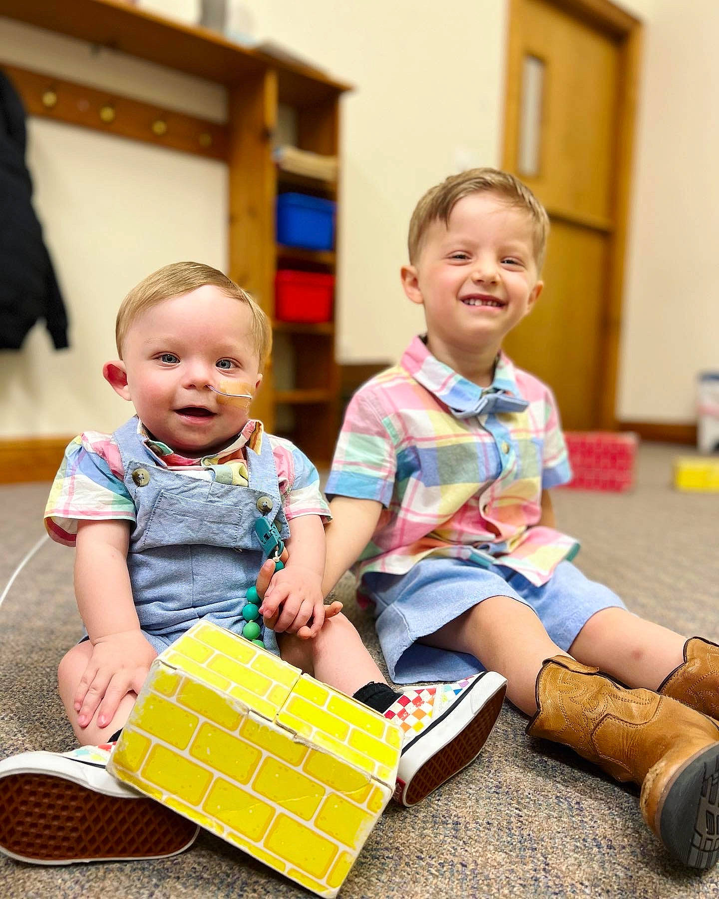 Anthony joined the competition — help win amazing prizes! baby_toddler_clothing, child, event, facial_expression, flooring, fun, happy, joy, leisure, pattern, people, person, plaid, sharing, sitting, smile, sock, standing, t_shirt, toddler