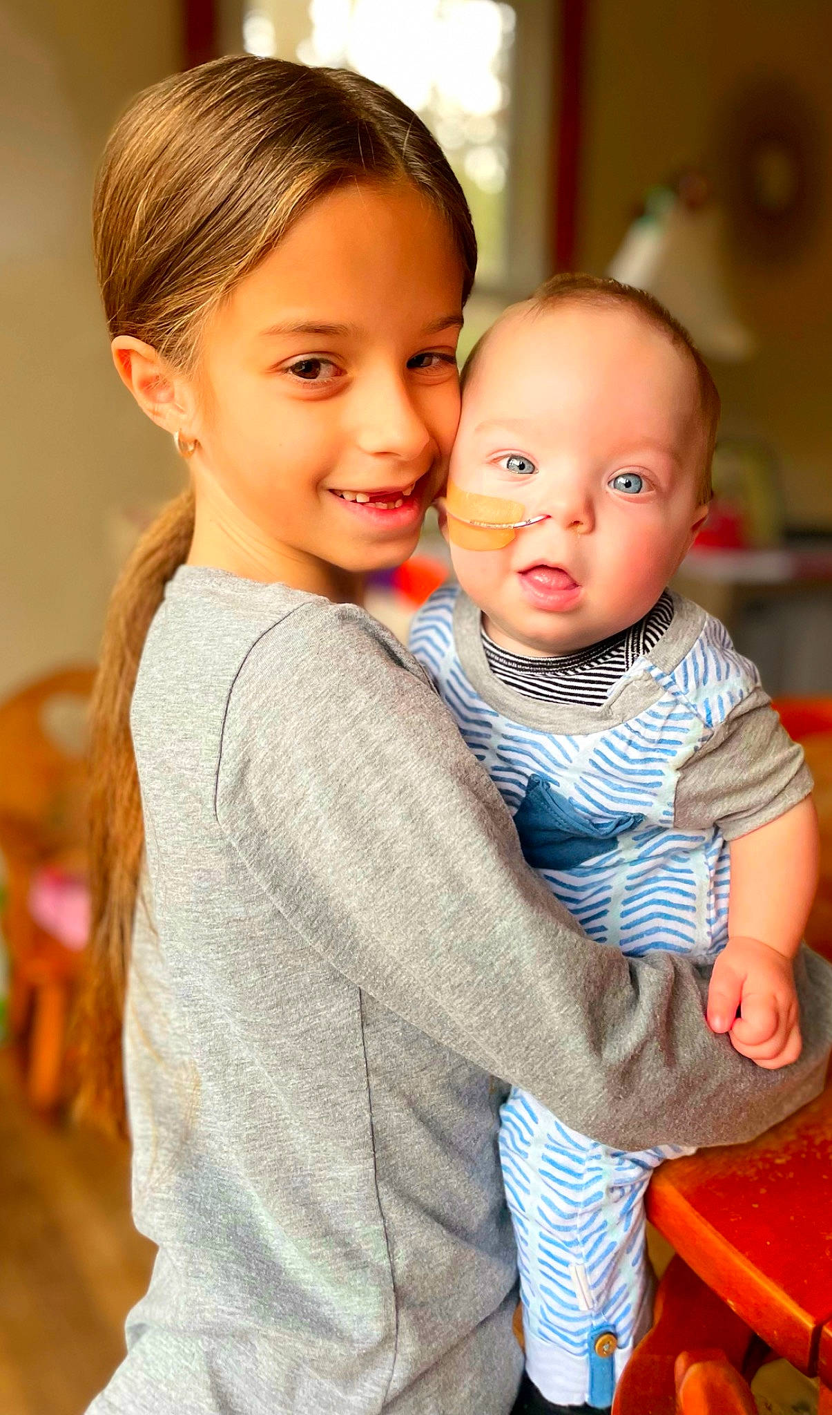 Anthony is registered to the contest to win money with this photo: baby_toddler_clothing, cheek, chin, eye, face, fun, gesture, hairstyle, happy, head, interaction, iris, joy, lip, nose, people, person, shoulder, skin, sleeve