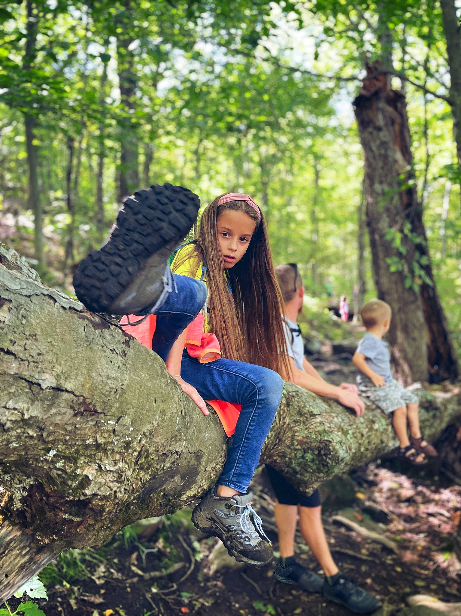 Tatiana is registered to the contest to win money with this photo: botany, branch, deciduous, denim, forest, fun, grass, hairstyle, happy, jeans, leisure, long_hair, natural_landscape, people_in_nature, person, plant, sneakers, sunglasses, tree, trunk