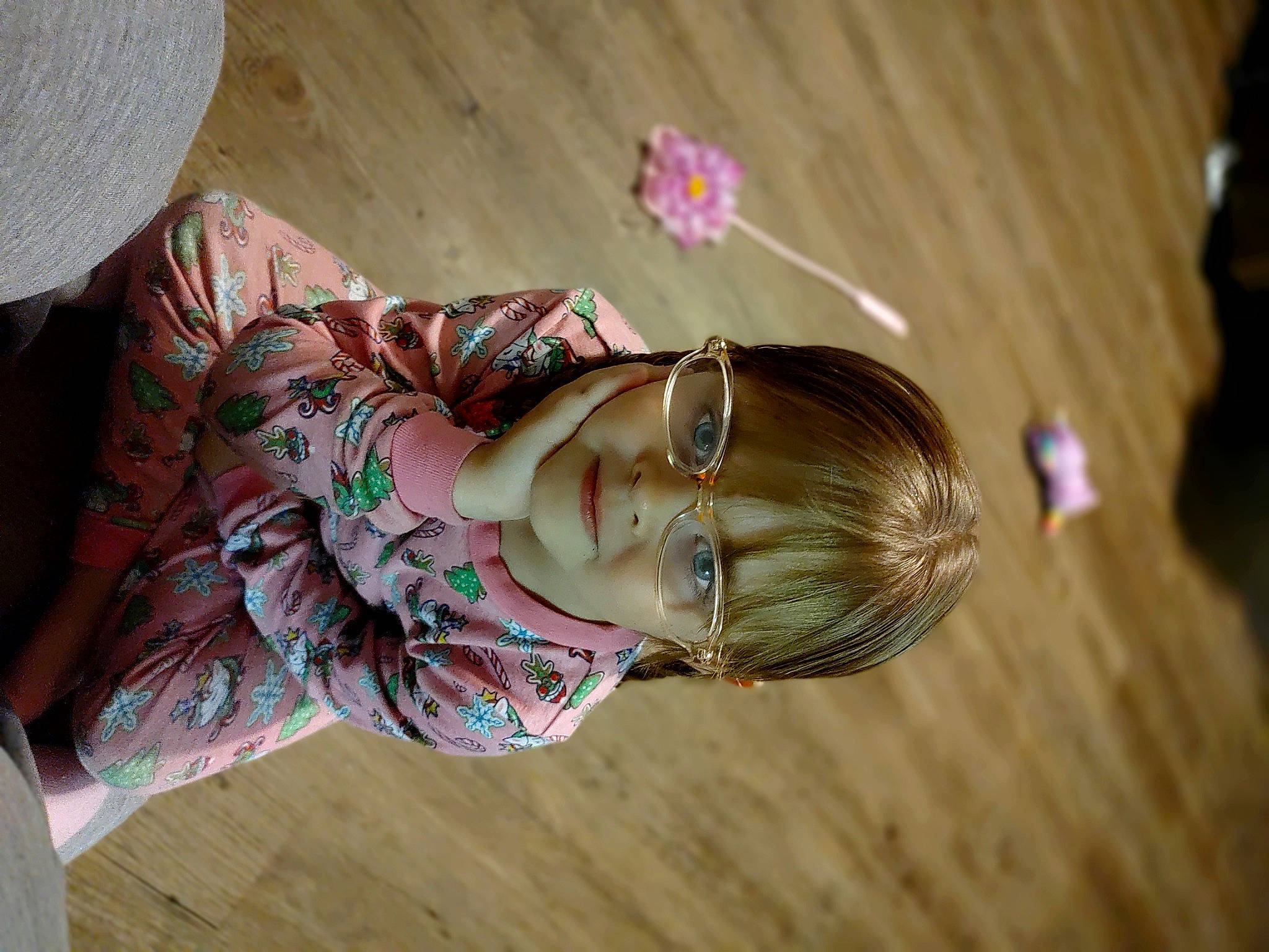 Kyleigh is registered to the contest to win money with this photo: brown_hair, child, eye, eyelash, eyewear, fashion_accessory, fashion_design, fun, glasses, hair_accessory, happy, head, headpiece, pattern, person, pink, skin, sunglasses, toddler, tree