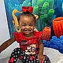 Elyana is registered to the contest to win money with this photo: toddler, child, smiling, red_bow, minnie_mouse, polka_dot, leggings, socks, medical_table, underwater_mural, seahorse, coral, fish, happy, cute, indoor, portrait, clothing, playful, baby