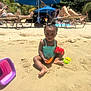 toddler, child, beach, sand, sand_toys, bucket, swimsuit, umbrella, lounge_chair, adult, relaxing, sunny, outdoor, summer, palm_tree, vacation, play, toy_crab, toy_scoop, family