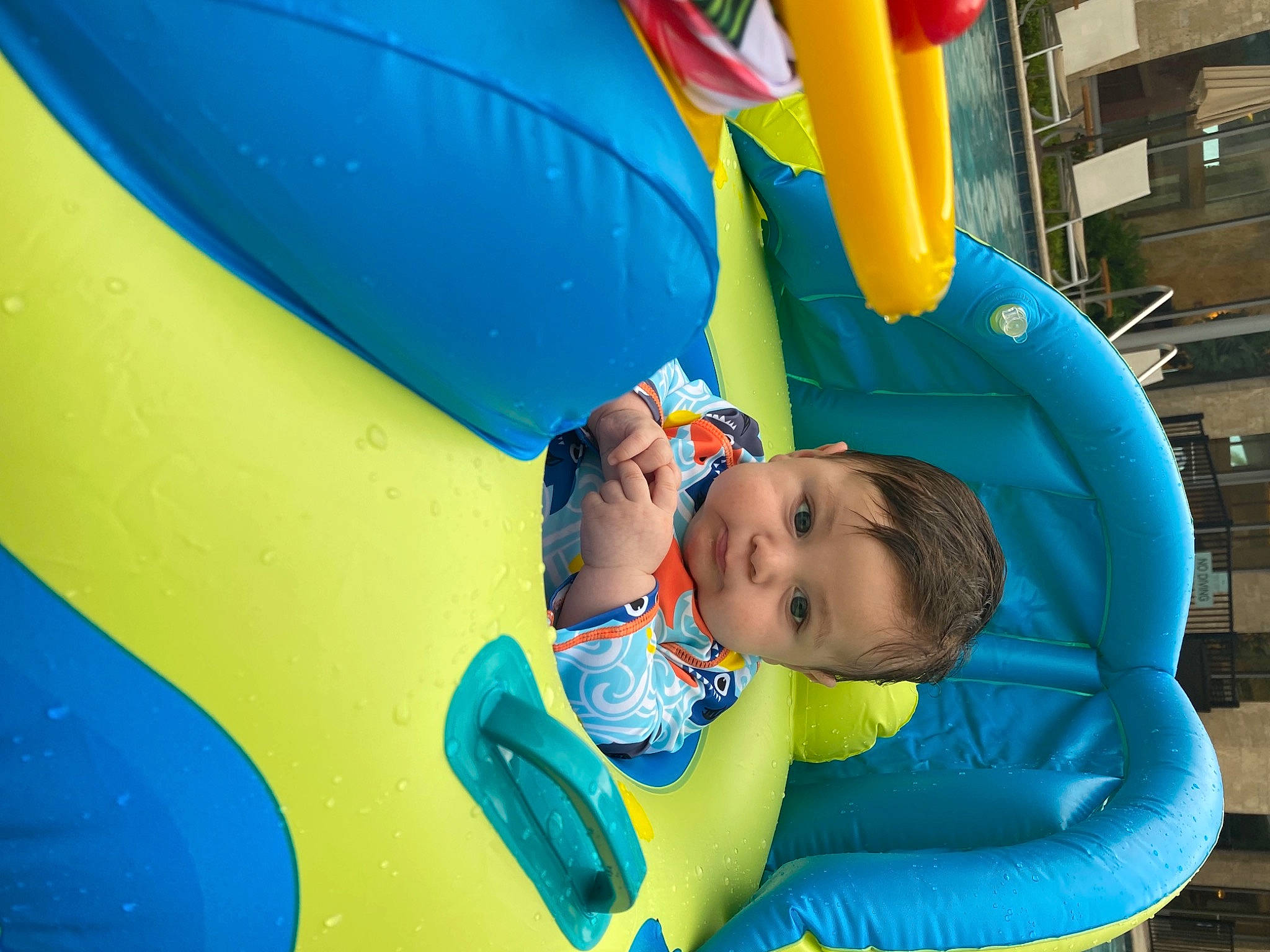 Eduardo is registered to the contest to win money with this photo: aqua, azure, baby, baby_toddler_clothing, blue, child, chute, comfort, electric_blue, fun, happy, inflatable, leisure, outdoor_play_equipment, outdoor_recreation, person, playground, recreation, snapshot, toddler