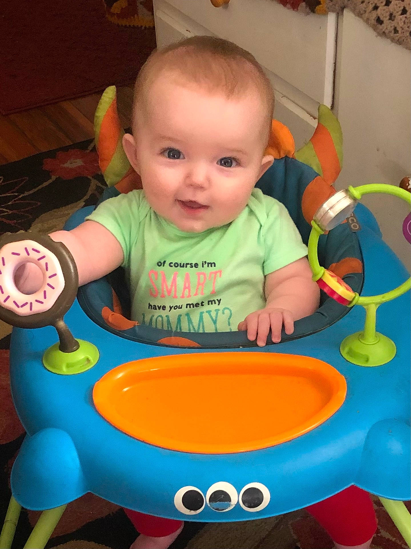 Mia is registered to the contest to win money with this photo: baby, baby_playing_with_toys, baby_products, baby_safety, baby_toddler_clothing, baby_toys, chair, child, circle, fun, person, plastic, play, product, room, sharing, sitting, smile, t_shirt, toddler