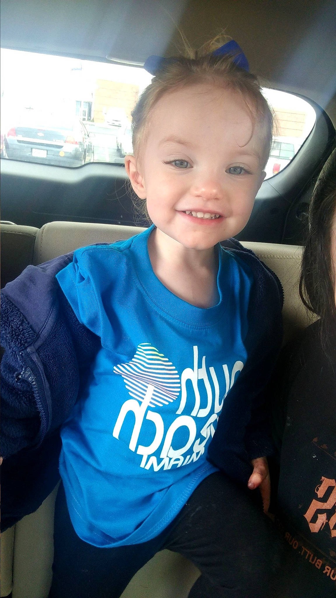 Aliyannah is registered to the contest to win money with this photo: blue, child, cool, face, forehead, hair, hairstyle, head, joy, neck, outerwear, people, person, photography, plant, skin, smile, t_shirt, technology, toddler