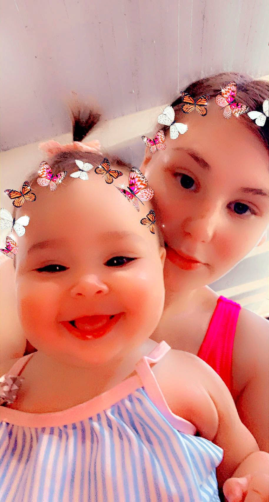 Ayana is registered to the contest to win money with this photo: baby_toddler_clothing, cheek, chin, eye, eyebrow, eyelash, fun, hairstyle, happy, headband, headgear, headpiece, joy, magenta, person, petal, pink, purple, skin, smile