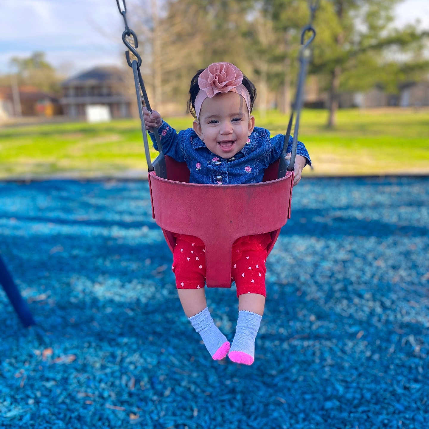 Alia is registered to the contest to win money with this photo: baby, clothing, coat, face, grass, head, hosiery, nature, outdoorplayarea, outdoors, park, person, photography, plant, playarea, portrait, sock, toy, tree, vegetation
