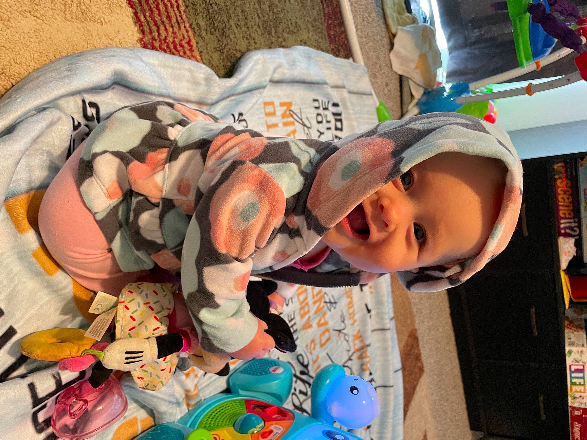 Stevie is registered to the contest to win money with this photo: baby, cap, child, eye, fashion_accessory, fun, happy, hat, headgear, leisure, pattern, person, play, product, room, shelf, smile, t_shirt, toddler, travel