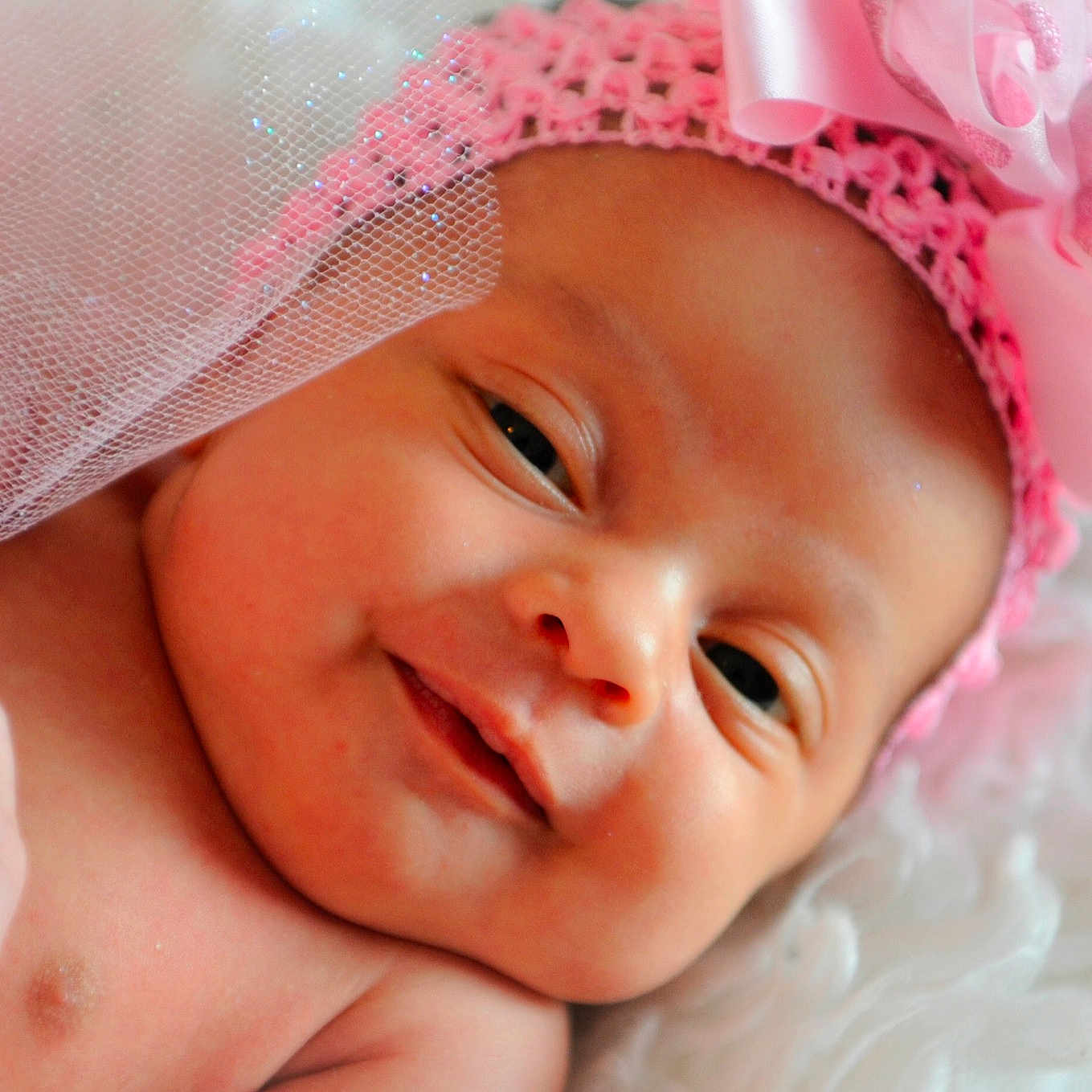 Nakya is registered to the contest to win money with this photo: baby, bedtime, cheek, child, close_up, face, fashion_accessory, hair_accessory, head, headband, headgear, joy, lip, mouth, nose, person, photography, pink, portrait_photography, skin