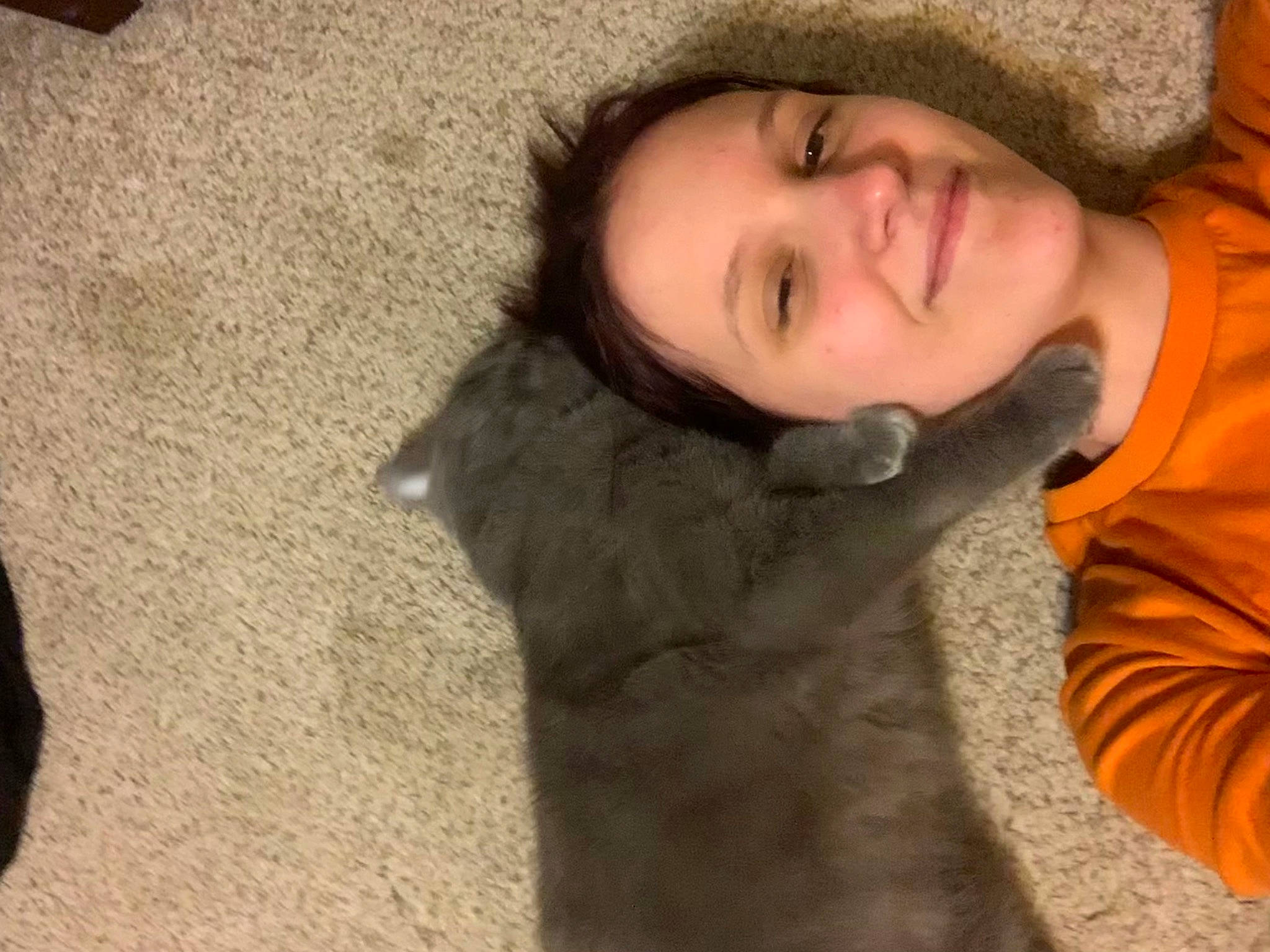 Tubby is registered to the contest to win money with this photo: chin, comfort, eye, fun, fur, gesture, happy, human_body, jacket, jaw, lip, mouth, neck, nose, skin, smile, textile, tree, vertebrate, wood