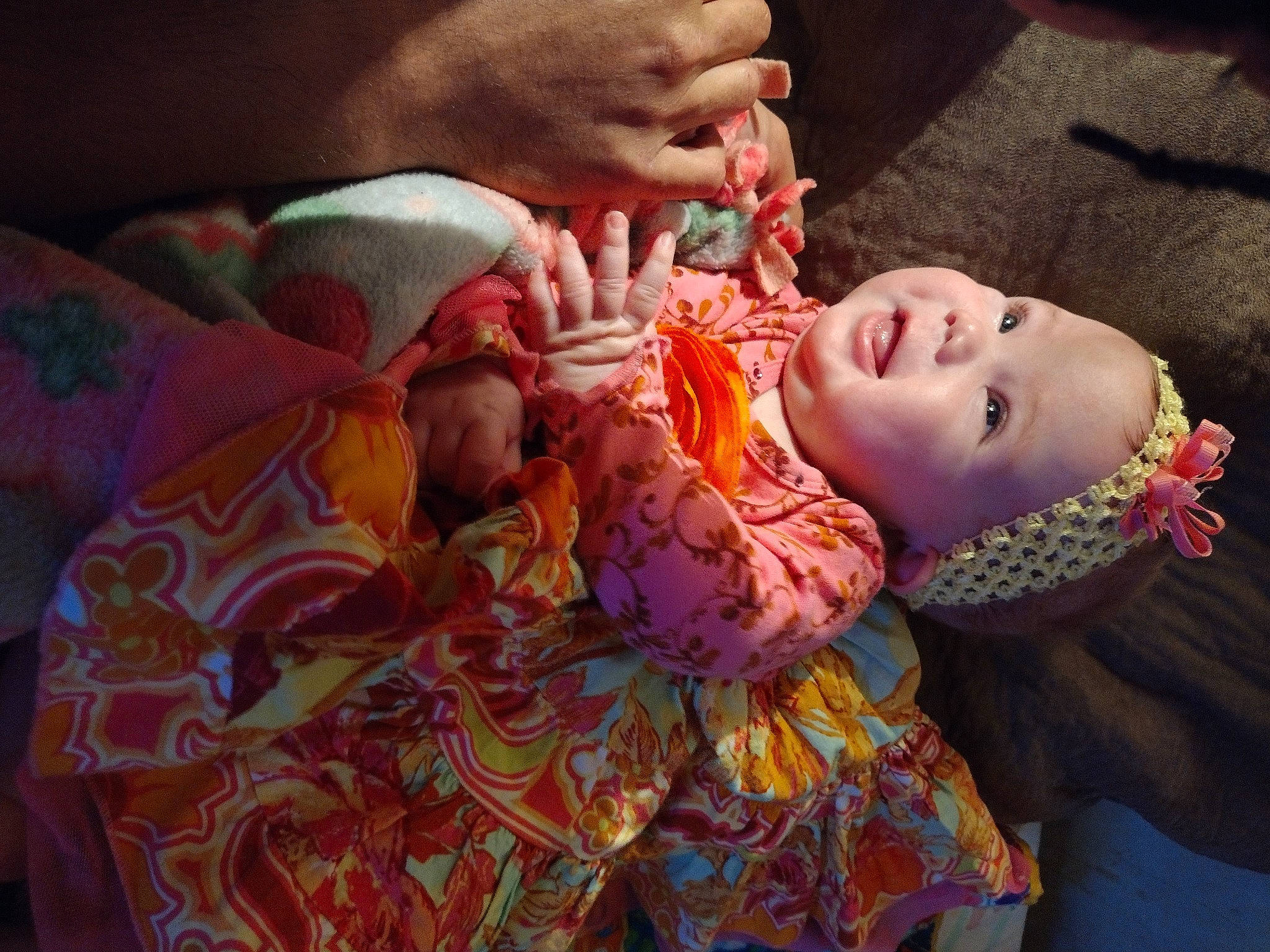 Kiarah is registered to the contest to win money with this photo: baby, cheek, child, comfort, event, eye, eyelash, face, flesh, happy, head, linens, lip, mouth, orange, pattern, person, skin, textile, toddler