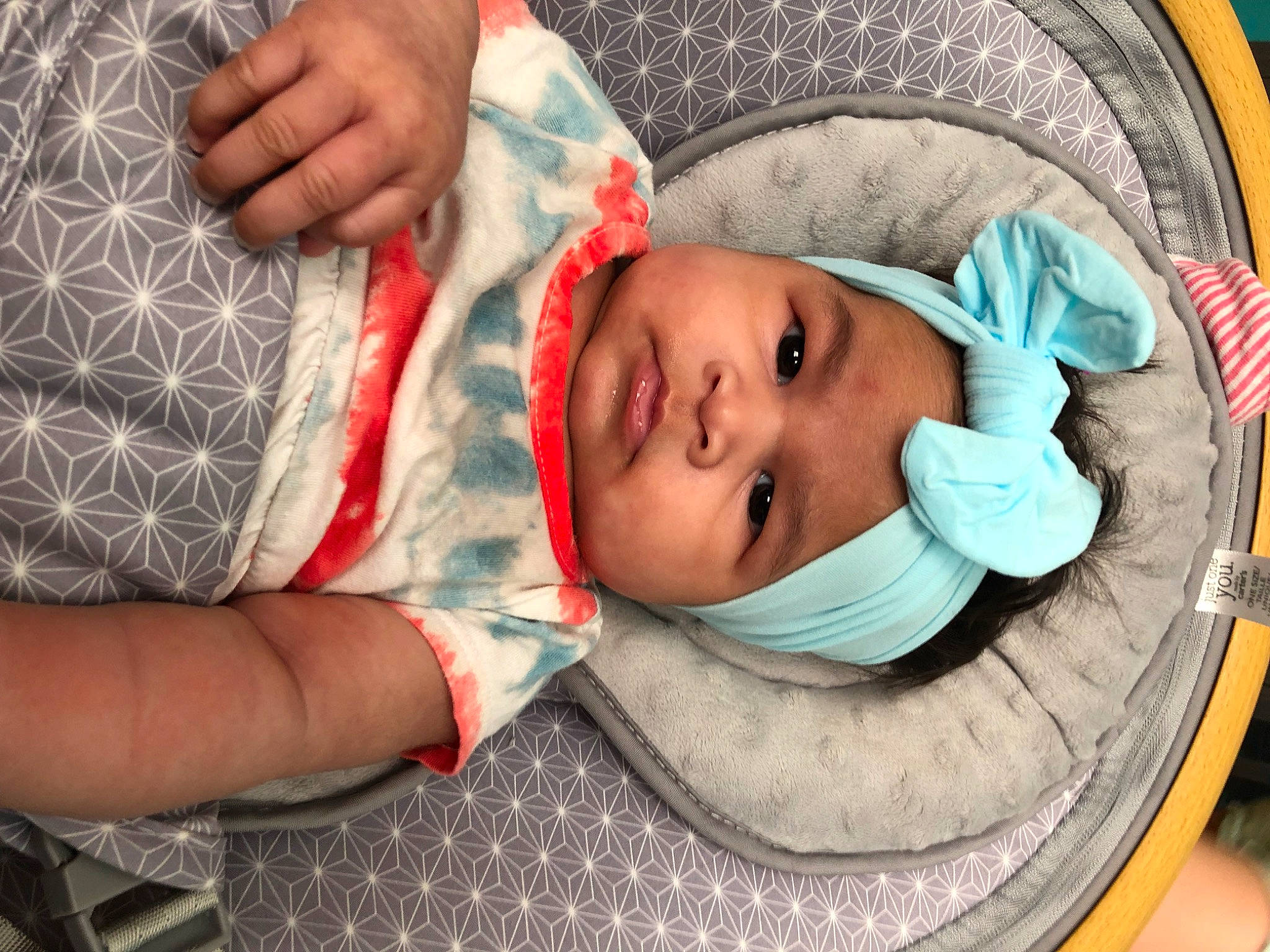 Bri joined the competition — help win amazing prizes! baby, baby_products, baby_toddler_clothing, cheek, child, comfort, eye, finger, gesture, hand, hat, headwear, linens, mouth, nose, pattern, person, room, skin, thumb