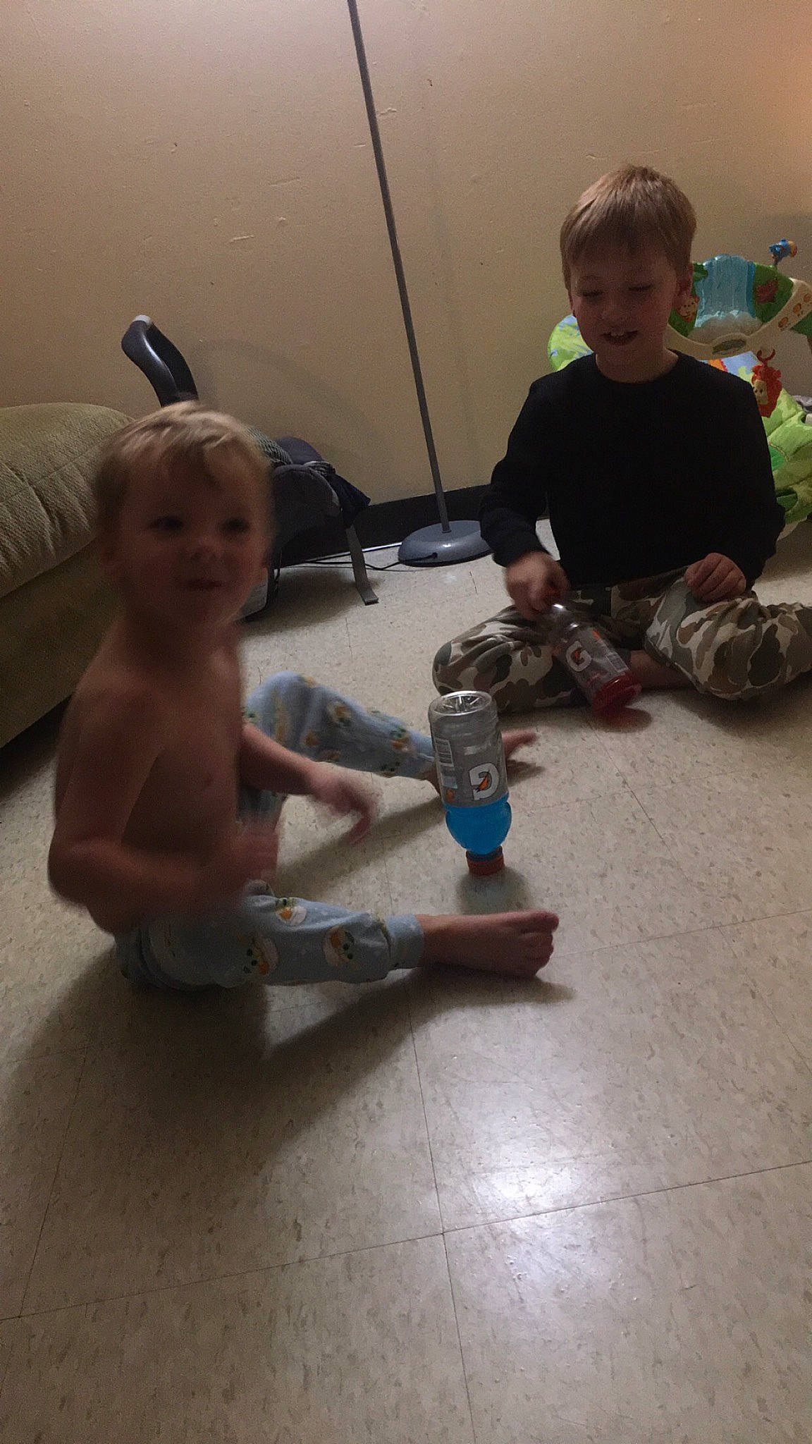 Kameron joined the competition — help win amazing prizes! arm, baby, chest, child, finger, floor, flooring, foot, fun, hardwood, head, human_leg, joint, knee, person, sitting, smile, toddler, toy, toy_vehicle