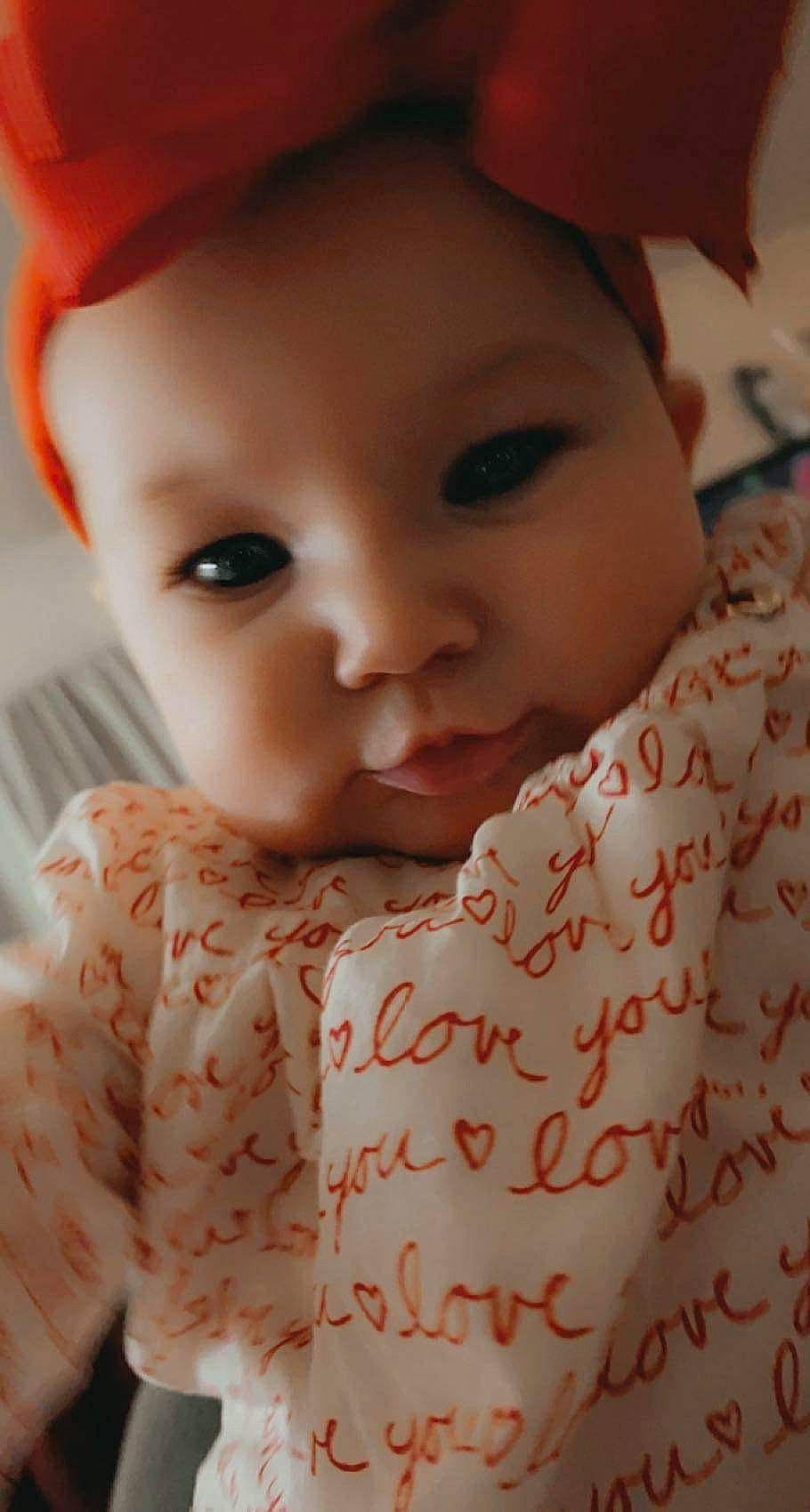Camellia is registered to the contest to win money with this photo: baby, baby_toddler_clothing, cheek, chin, dress, eyebrow, eyelash, face, facial_expression, human, iris, lip, mouth, nose, organ, outerwear, person, pink, skin, sleeve