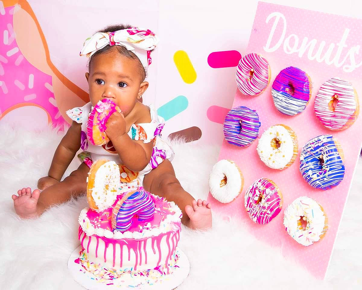 Alaiyah joined the competition — help win amazing prizes! baby_toddler_clothing, baked_goods, cake, cake_decorating, cake_decorating_supply, costume_accessory, cuisine, dessert, food, hair_accessory, headpiece, ingredient, magenta, party, party_supply, person, pink, plate, sugar_cake, sweetness