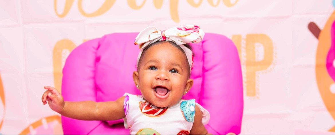 Alaiyah is registered to the contest to win money with this photo: baby, baby_laughing, baby_toddler_clothing, child, costume_accessory, embellishment, hair_accessory, happy, headband, headgear, headpiece, magenta, peach, person, pink, toddler, tongue