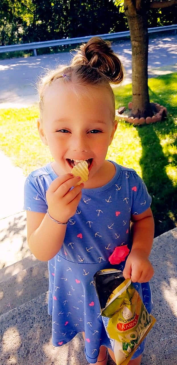 Aleigha is registered to the contest to win money with this photo: child, child_model, eating, food, happy, joy, person, play, smile, summer, toddler, yellow