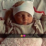 Aryah participe au concours pour gagner de l'argent avec cette photo : baby, beanie, blanket, cheeks, closed_eyes, cozy, crib, cute, emoji_overlay, hat, infant, knitwear, newborn, pink_blanket, portrait, ruffles, sleeping, snapchat_strip, soft_texture, swaddle