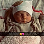baby, beanie, blanket, cheeks, closed_eyes, cozy, crib, cute, emoji_overlay, hat, infant, knitwear, newborn, pink_blanket, portrait, ruffles, sleeping, snapchat_strip, soft_texture, swaddle