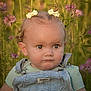 toddler, child, portrait, outdoor, flower, greenery, denim_overalls, hair_bows, blue_eyes, cute, serious_expression, nature, summer, baby, person, closeup, soft_light, photography, garden, casual_clothing