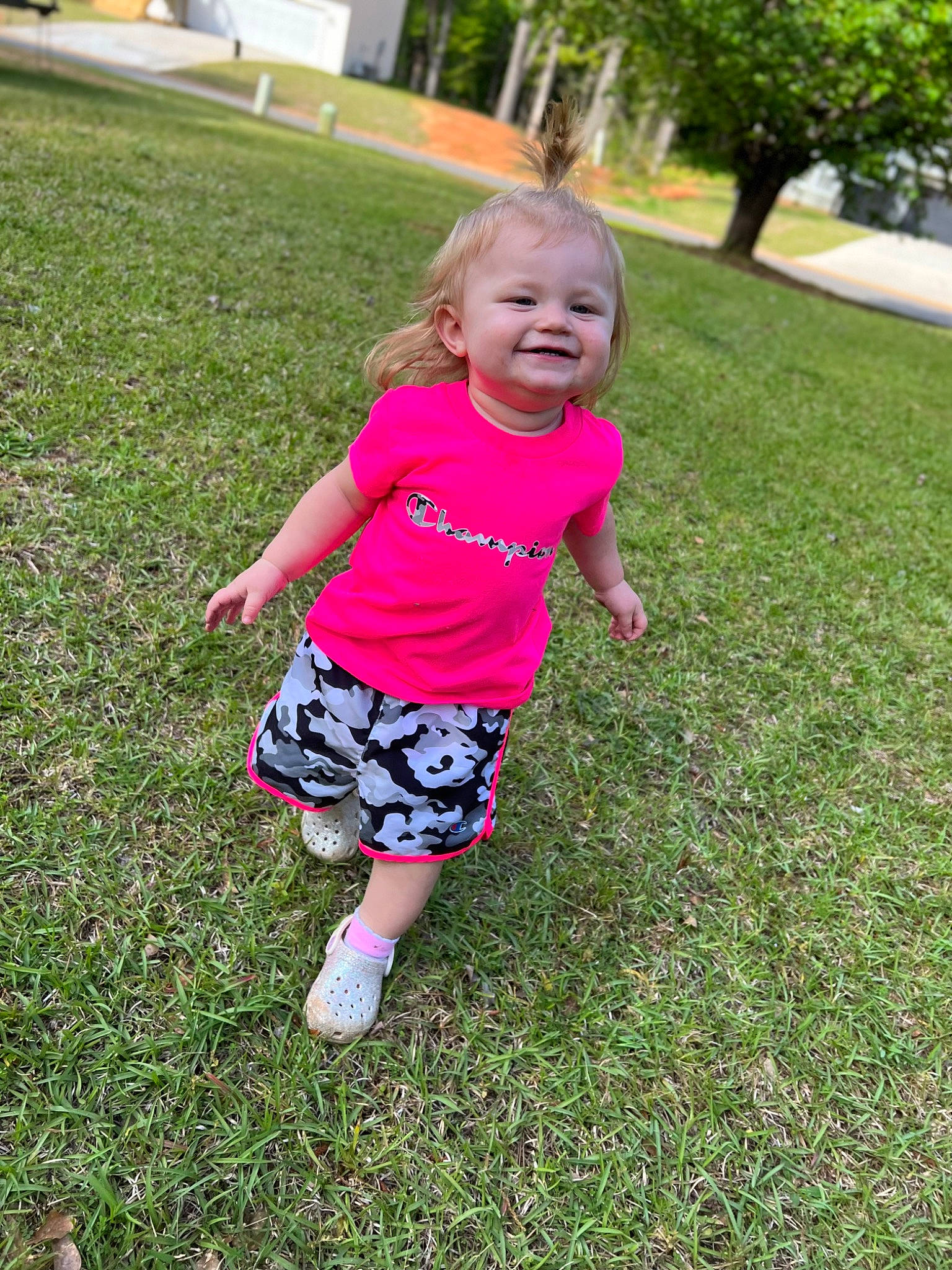 Emilee is registered to the contest to win money with this photo: baby_toddler_clothing, fun, grass, grass_family, grassland, groundcover, happy, joy, lawn, leisure, meadow, nature, people_in_nature, person, pink, plant, shorts, smile, summer, toddler