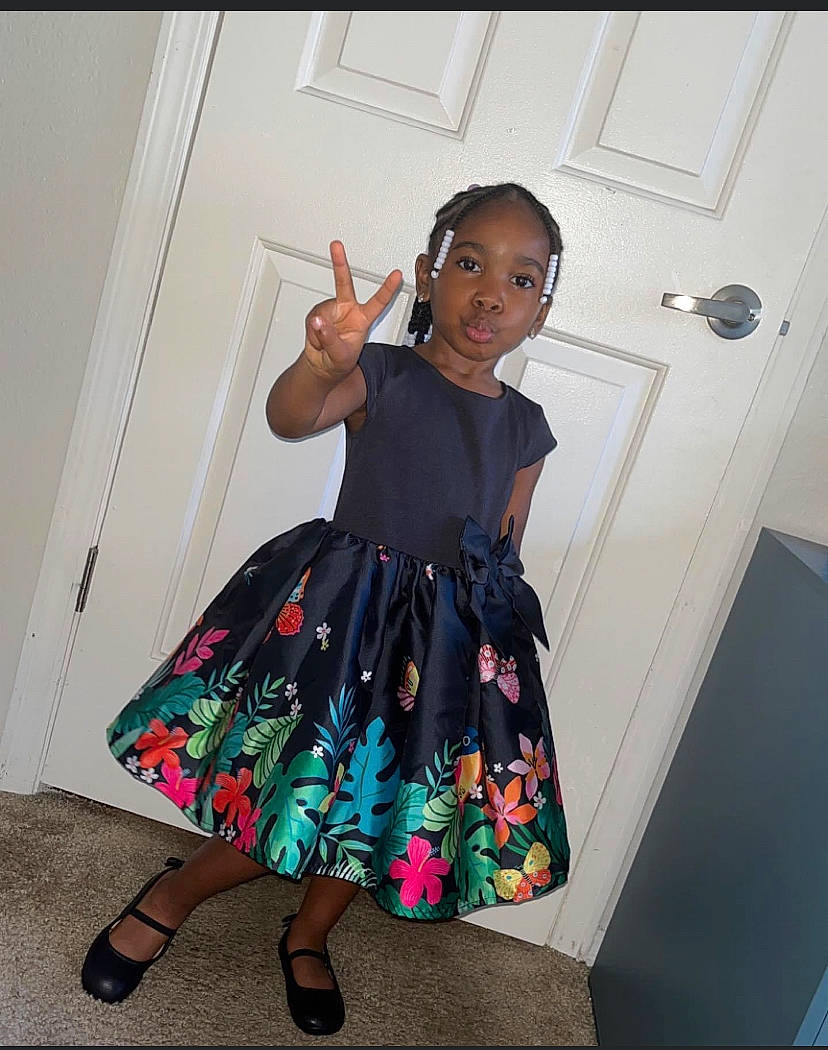 Aziyah joined the competition — help win amazing prizes! arm, day_dress, door, dress, fashion_design, finger, fun, gesture, hand, happy, joint, knee, neck, one_piece_garment, person, shoulder, sleeve, thigh, toddler, trunk