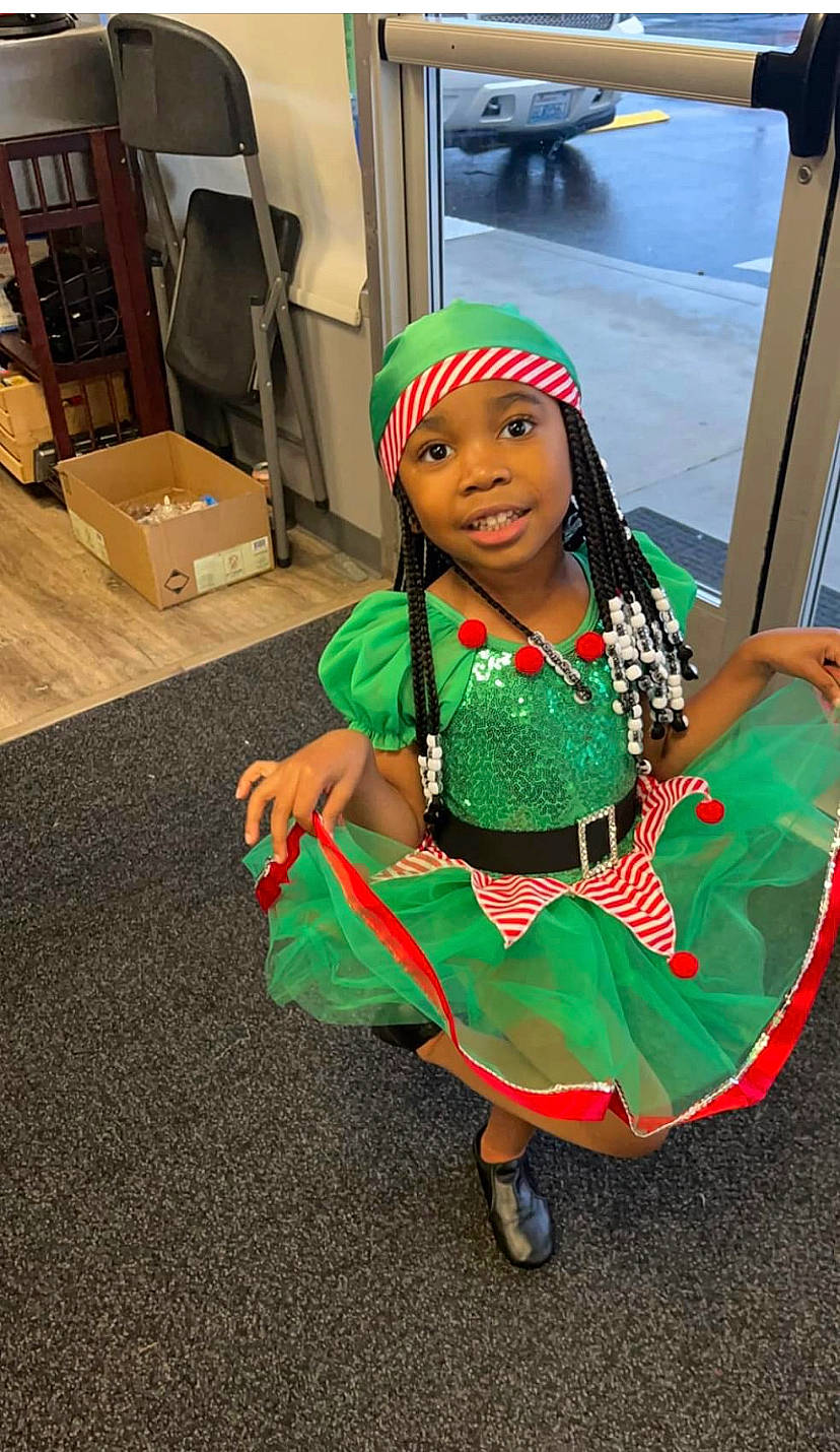 Aziyah is registered to the contest to win money with this photo: animation, box, carton, child, cosplay, costume, costume_hat, entertainment, event, fashion_accessory, fashion_design, flooring, fun, hat, headwear, holiday, person, sandal, shipping_box, smile