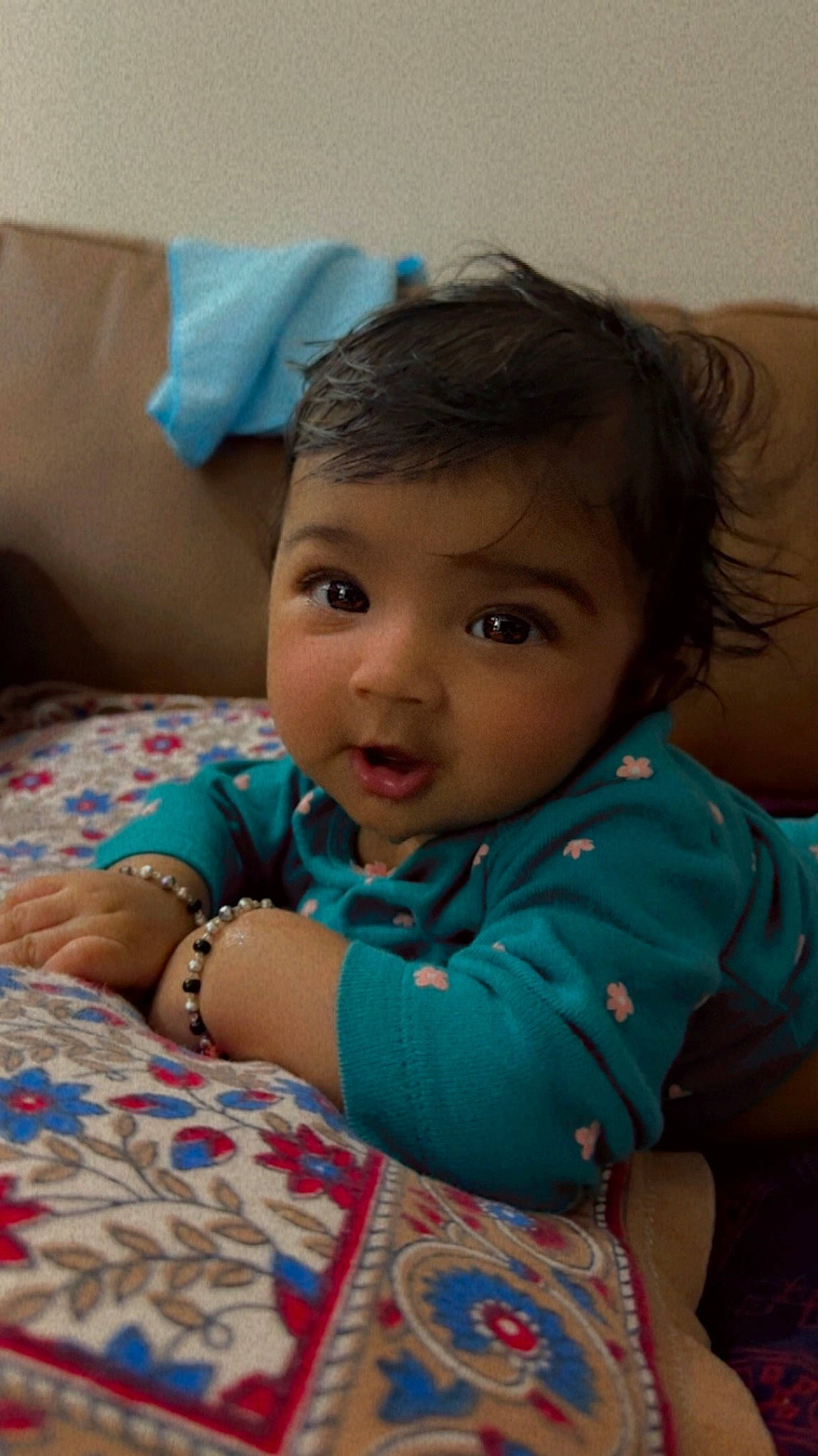 Anaya joined the competition — help win amazing prizes! baby_toddler_clothing, cheek, child, chin, comfort, eye, fun, happy, head, iris, leisure, linens, nose, pattern, person, room, sitting, skin, sleeve, smile