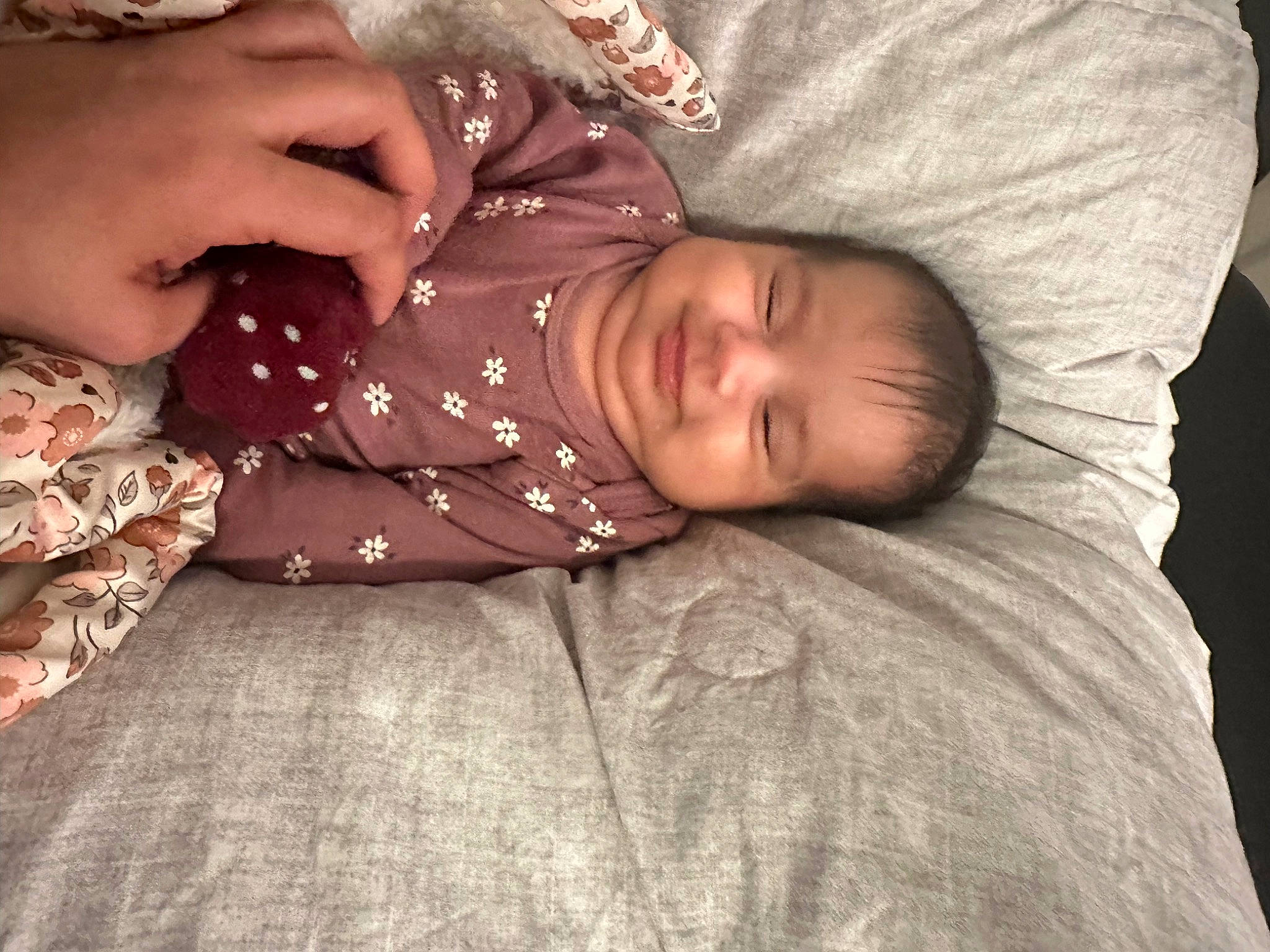 Ava Reign is registered to the contest to win money with this photo: baby, baby_toddler_clothing, bedtime, child, comfort, couch, eye, flooring, gesture, hand, happy, joy, linens, nose, pattern, person, room, sitting, skin, sleeve