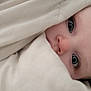baby, blanket, bed, face, child, blue_eyes, comfort, cozy, cute, expression, face_closeup, head, infant, indoors, light, looking, person, portrait, sleeping, soft