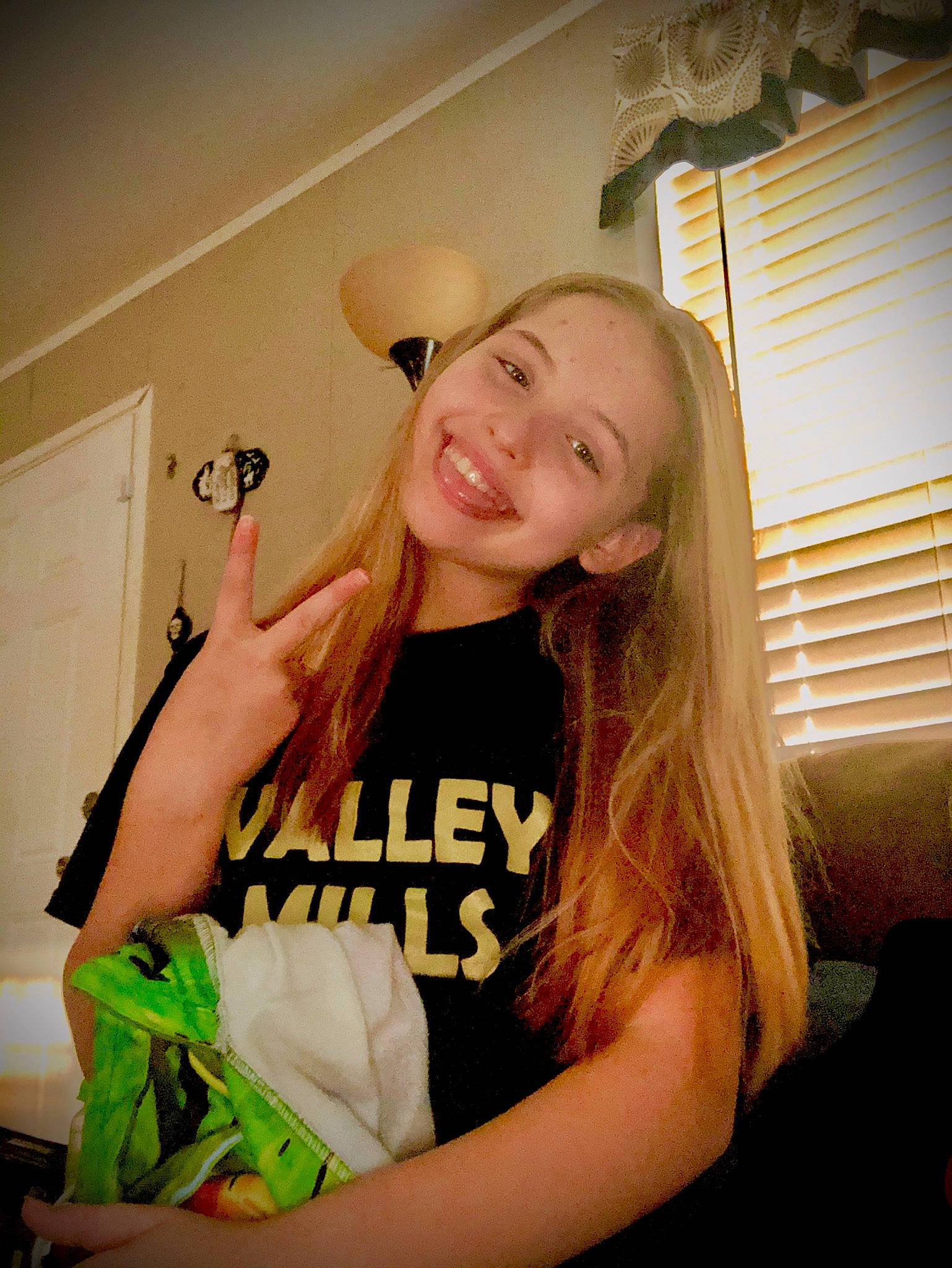 Lillian joined the competition — help win amazing prizes! blond, brown_hair, door, home_door, interior_design, joy, layered_hair, light_fixture, lighting, long_hair, person, throat, tooth, window_blind, window_covering, window_treatment