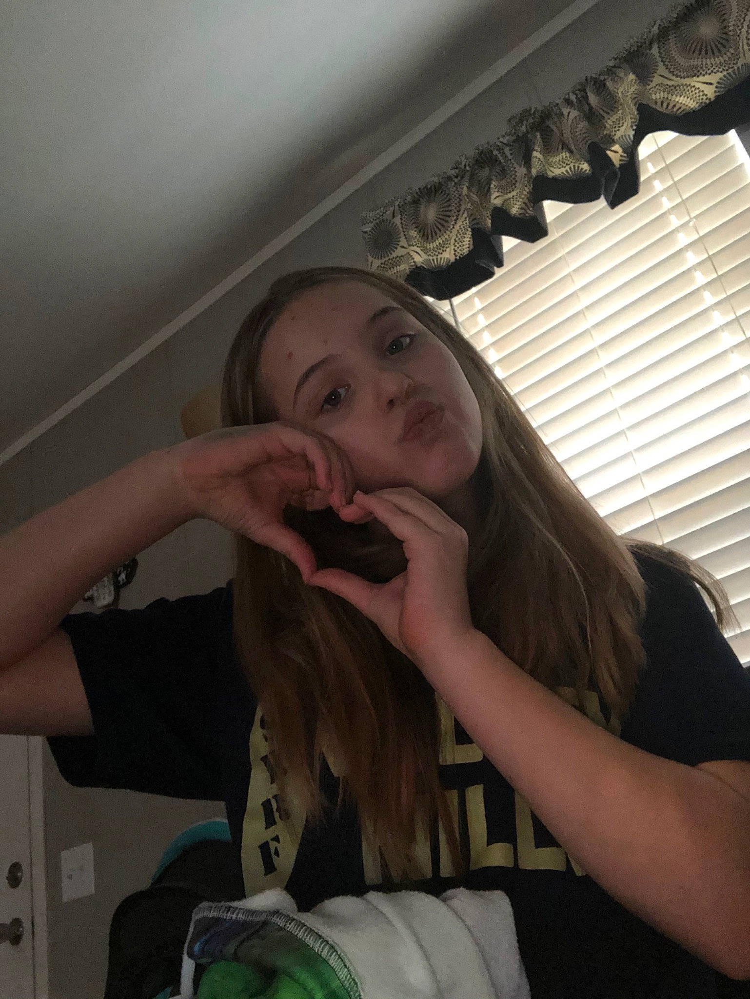 Lillian is registered to the contest to win money with this photo: bag, brown_hair, eating, food_craving, hand, jaw, lip, long_hair, nail, person, selfie, taste, throat, tints_and_shades, tooth, window_blind, window_covering, window_treatment