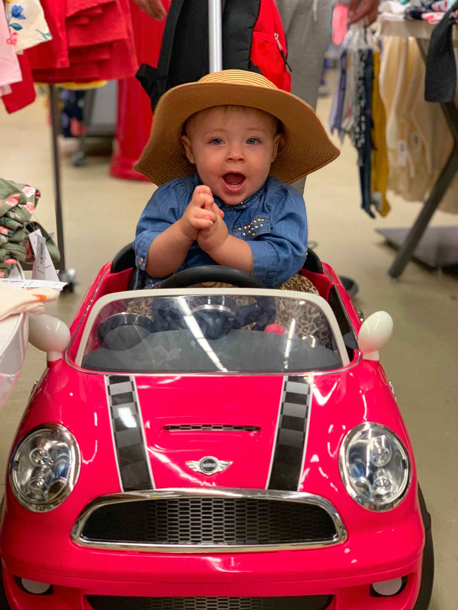 Roxy is registered to the contest to win money with this photo: automotive_design, car, child, city_car, classic, compact_car, headwear, hood, mini, mini_cooper, motor_vehicle, person, photography, pink, product, red, sports_car, subcompact_car, supercar, surprise