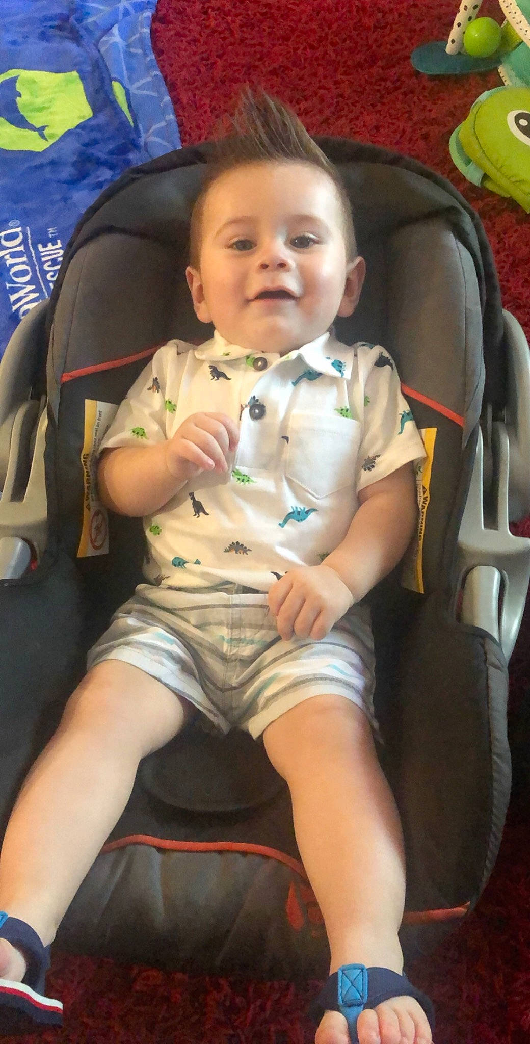 Iker is registered to the contest to win money with this photo: baby, baby_carriage, chair, cheek, comfort, eye, finger, fun, head, human_leg, knee, lap, leg, mouth, person, shorts, skin, smile, thigh, toddler