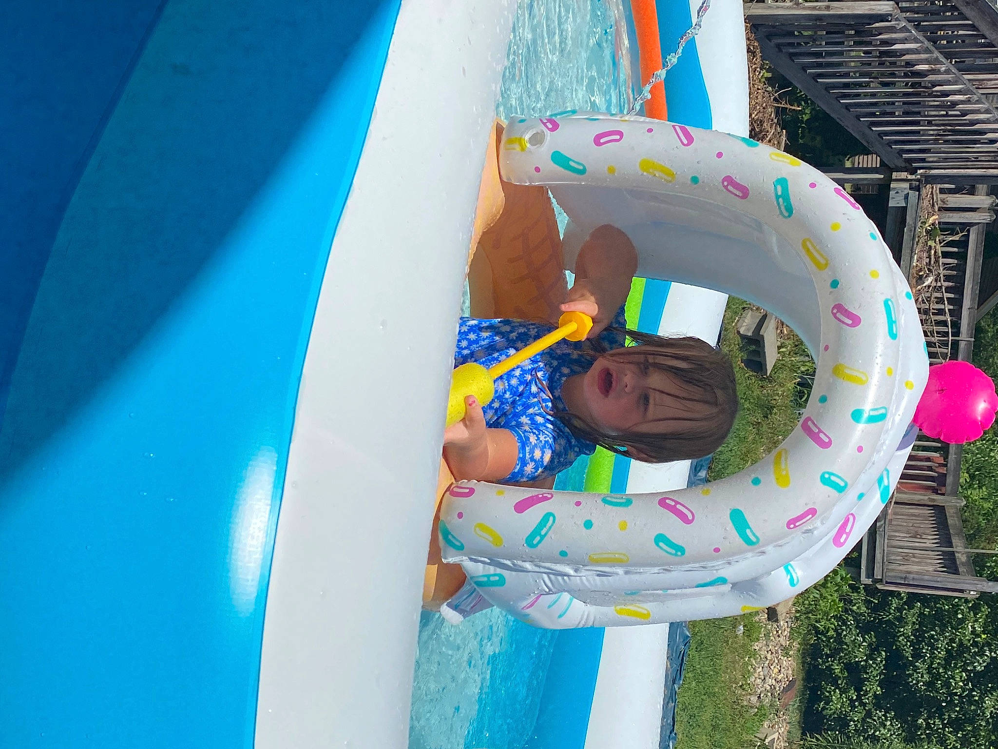 Scarlett is registered to the contest to win money with this photo: amusement_park, aqua, azure, blue, child, chute, electric_blue, event, fun, games, happy, headwear, inflatable, leisure, party_supply, person, pink, plant, play, recreation