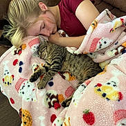 Sassy joined the competition — help win amazing prizes! blanket, brown_couch, cat, closeup, comfort, couch, cozy, cute, domestic_animal, feline, indoor, kitten, nap, patterned_blanket, person, relaxation, resting, sleeping, tabby_cat, young_person